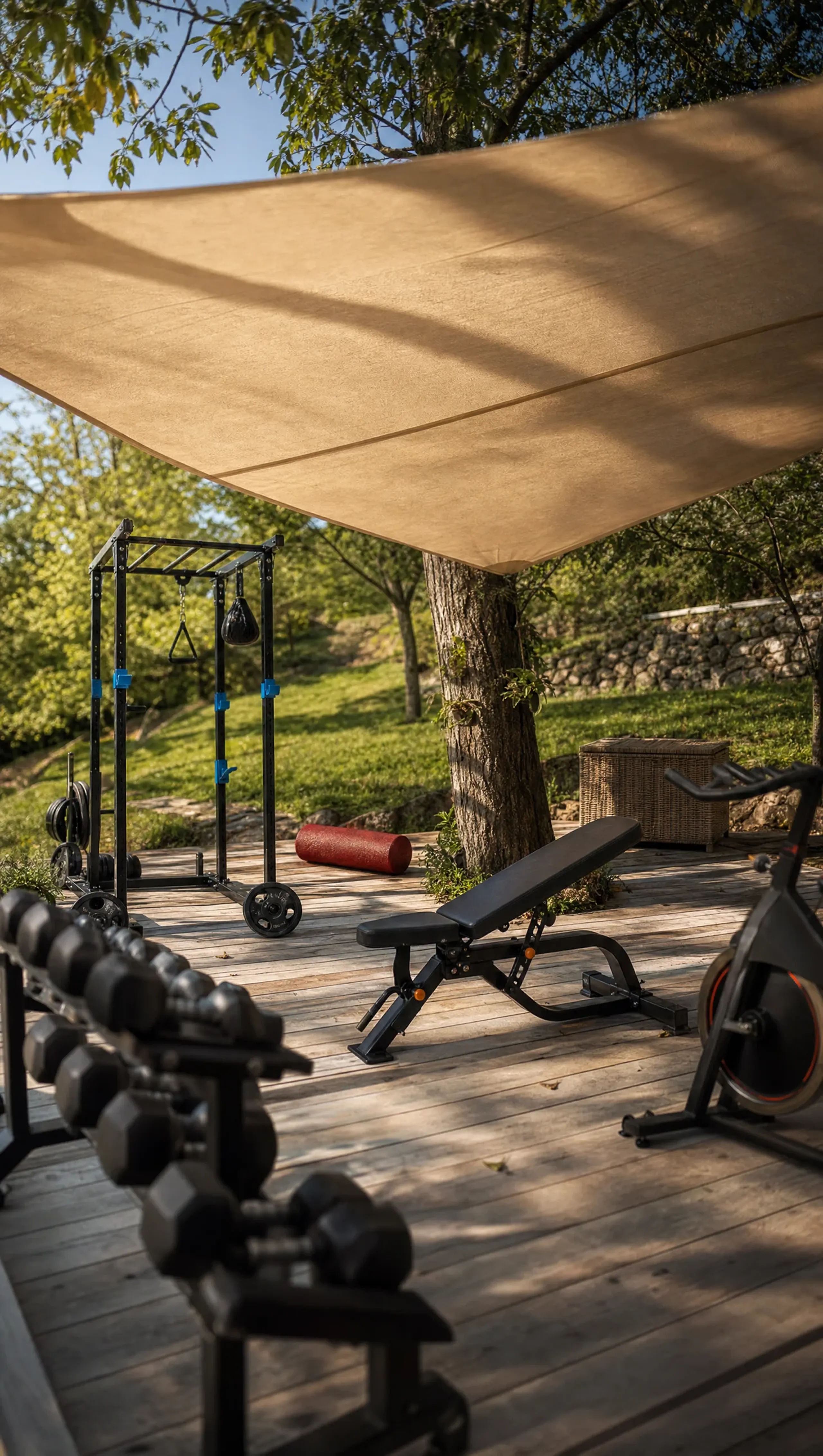 Dumbbells and a bench on the open-air training deck