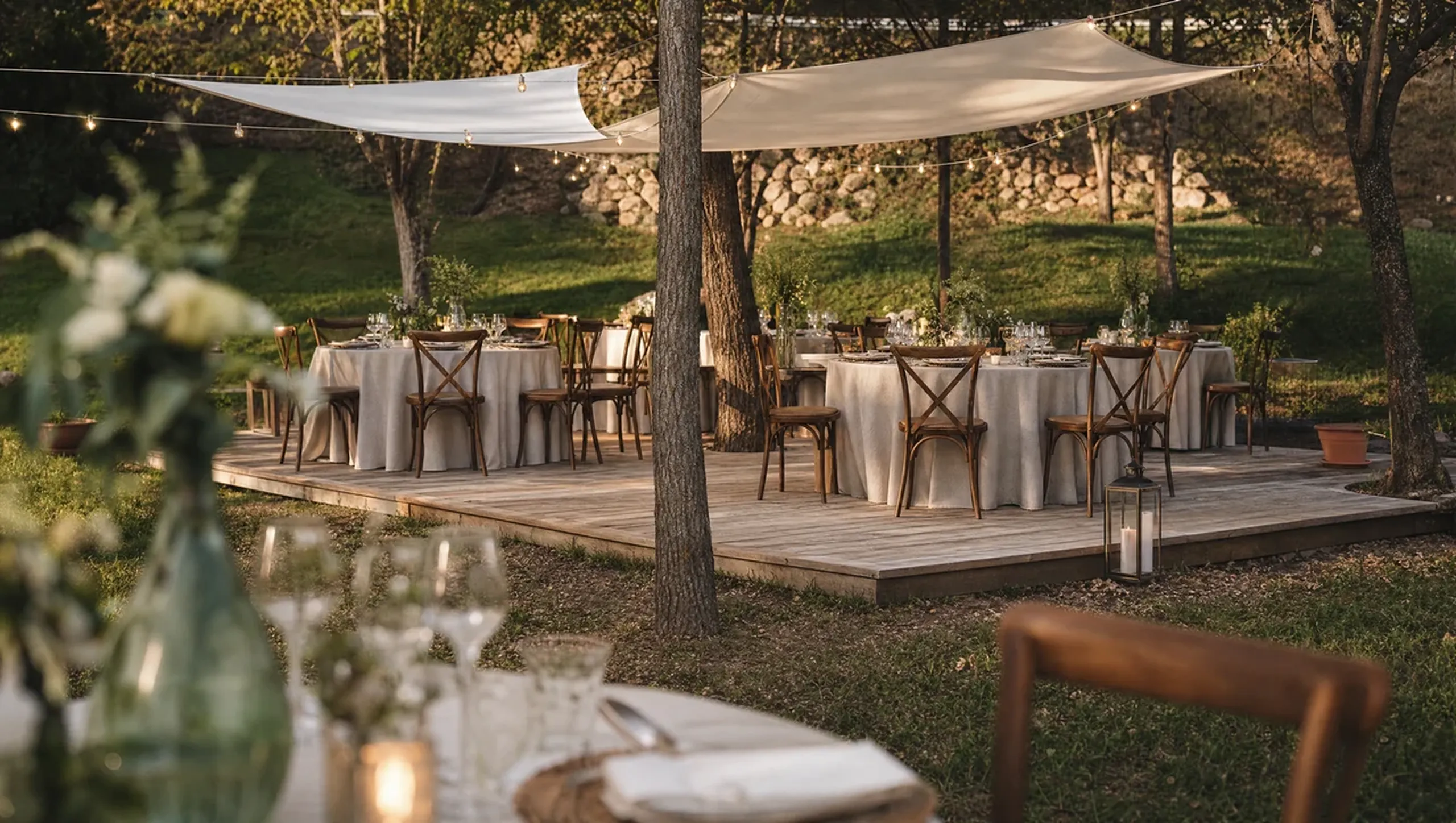 Tables set for an outdoor dinner under the canopy