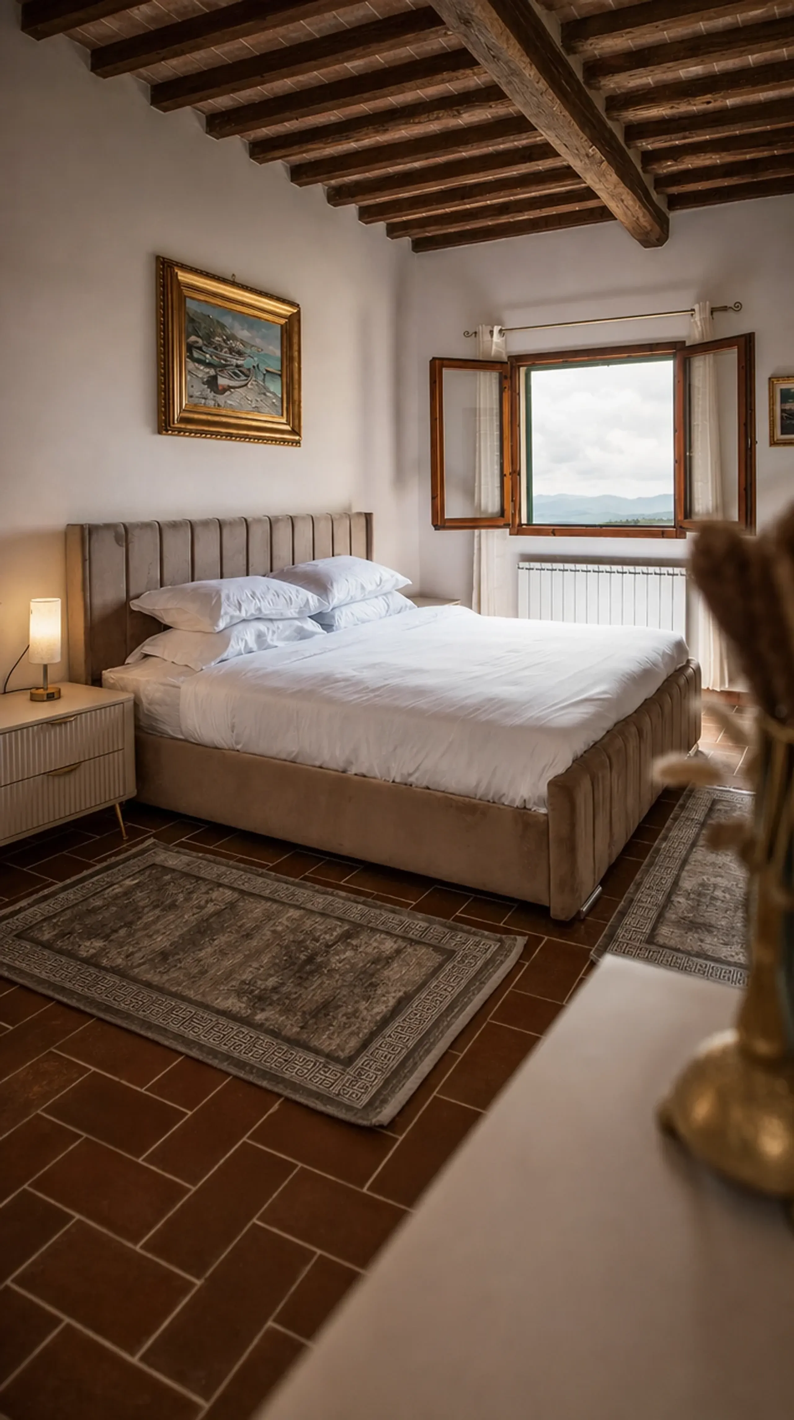 A restful bedroom with a large window and Tuscan light